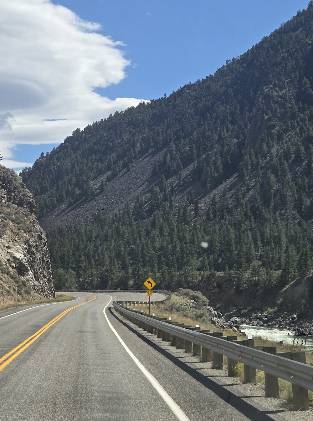 Highway 89 south heading into Gardiner with sharp turns and mountains and cliffs to both sides