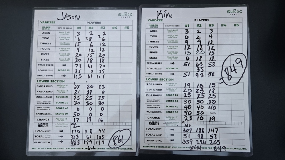Yahtzee cards showing Jason winning at 861 and Kim at 849