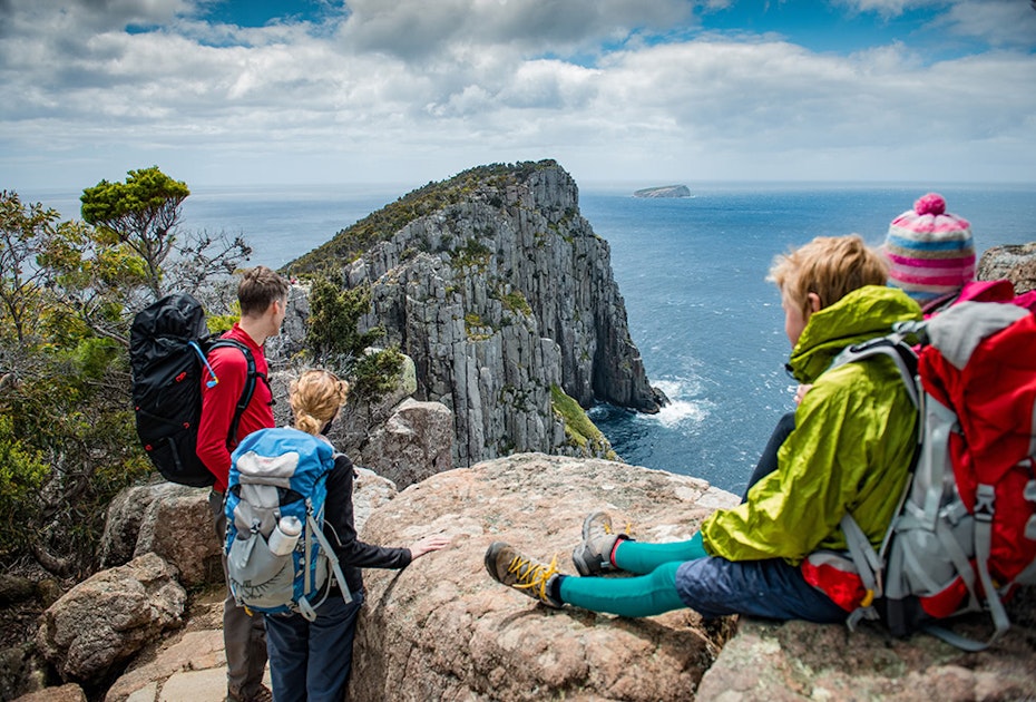Hikers resting on Three Capes Track, Cape Hauy