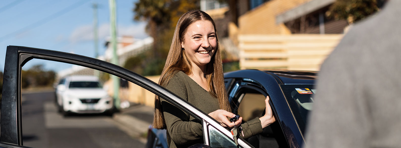 Learner driving getting car keys.