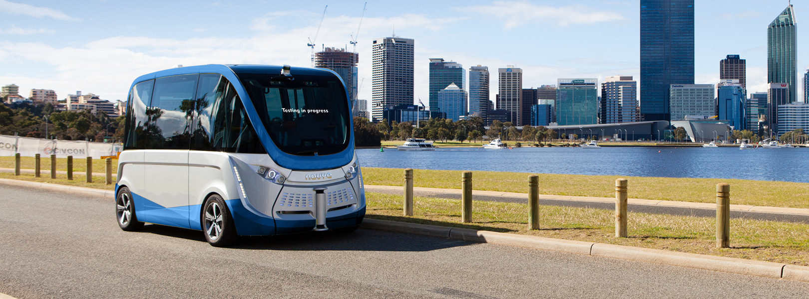 Self-driving electric vehicle in front of city
