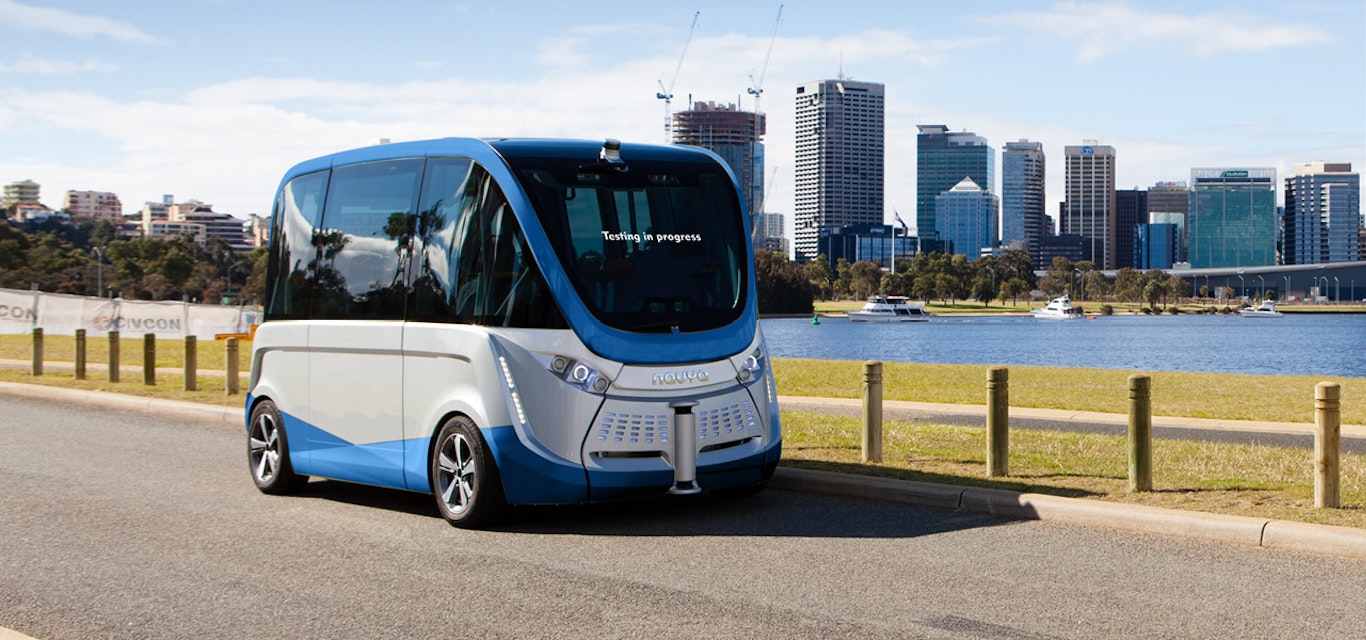 Self-driving electric vehicle in front of city