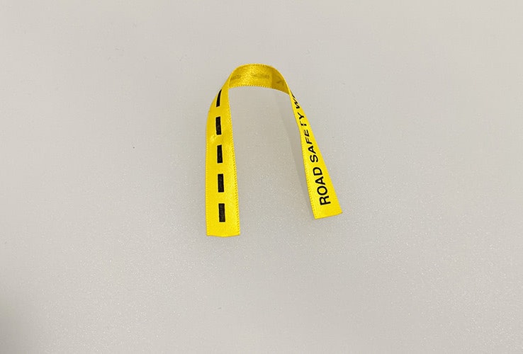 a short piece of yellow ribbon