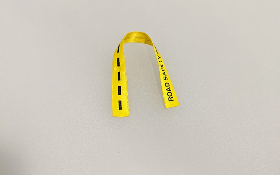 a short piece of yellow ribbon