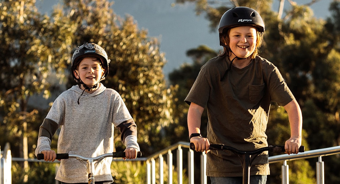 Two boys riding bikes