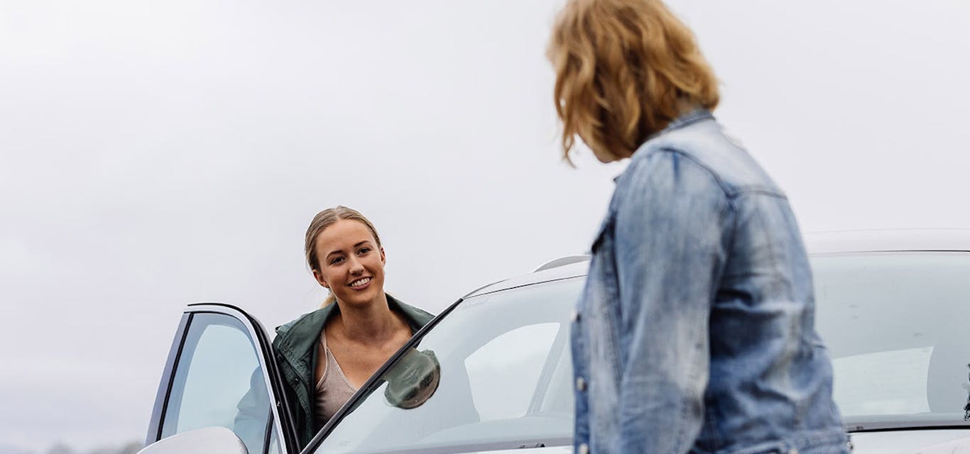 Learner driver getting into car with mother