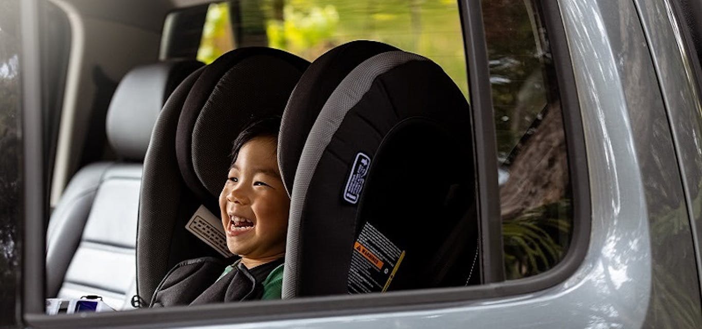 Child in back seat of car
