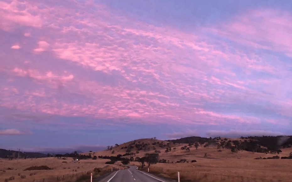 Sunset over road
