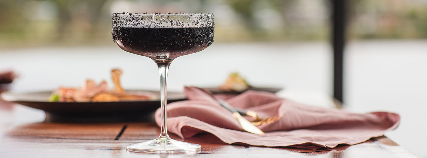 Close up shot of a dark coloured cocktail