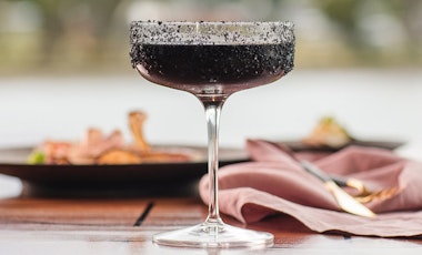 Close up shot of a dark coloured cocktail