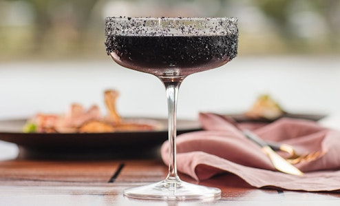 Close up shot of a dark coloured cocktail