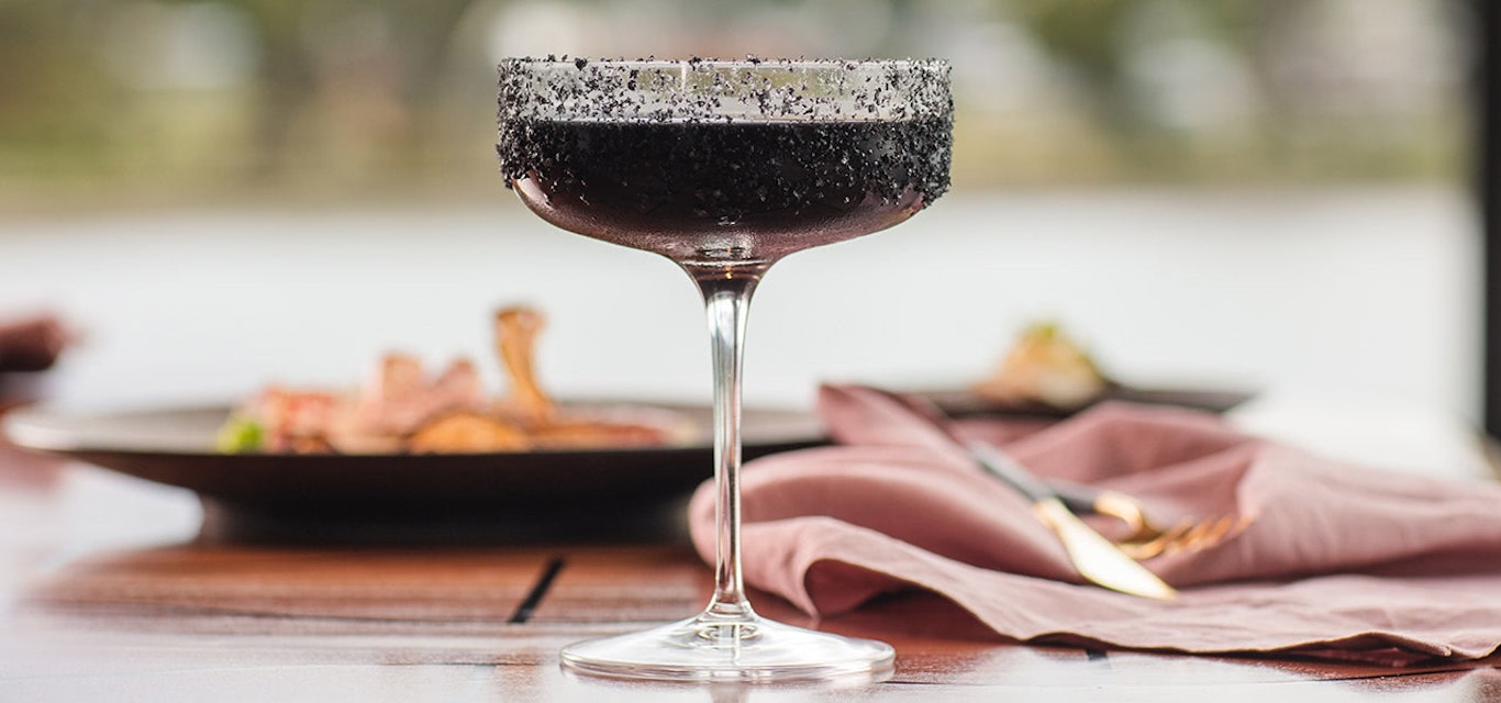 Dining at Mona | Image:Mona Close up shot of a dark coloured cocktail