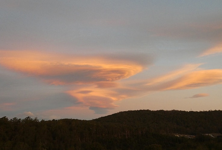 Swirling cloud patterns in teh sky at dusk