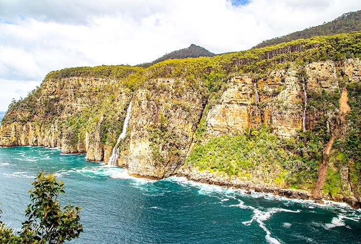 Cliff and water views of Waterfall Bay on the Tasman Peninsula