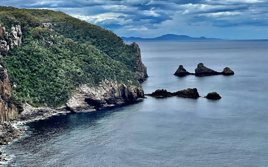 View of The Thumbs, water and cliffs at Fortescue Bay