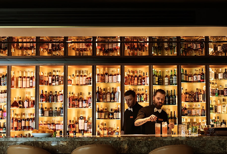 Two bartenders at Evolve Spirits Bar in Hobart