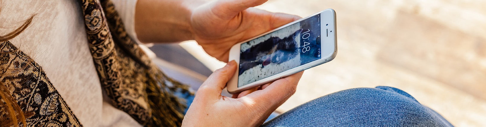 Person checking their mobile phone.