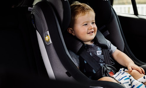 A toddler in a car seat