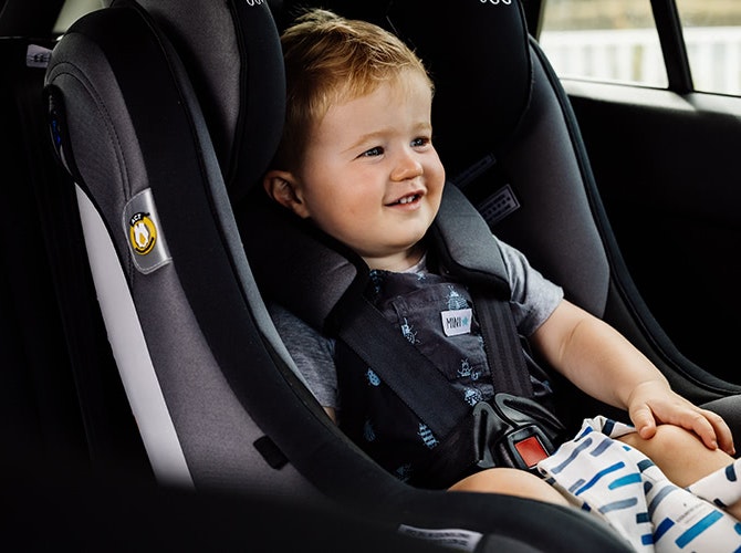 A toddler in a car seat