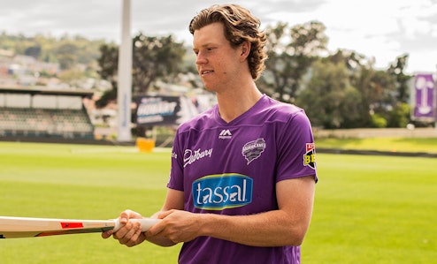 Mitch Owen of the Hurricanes practicing with bat and ball at Bellerive Oval