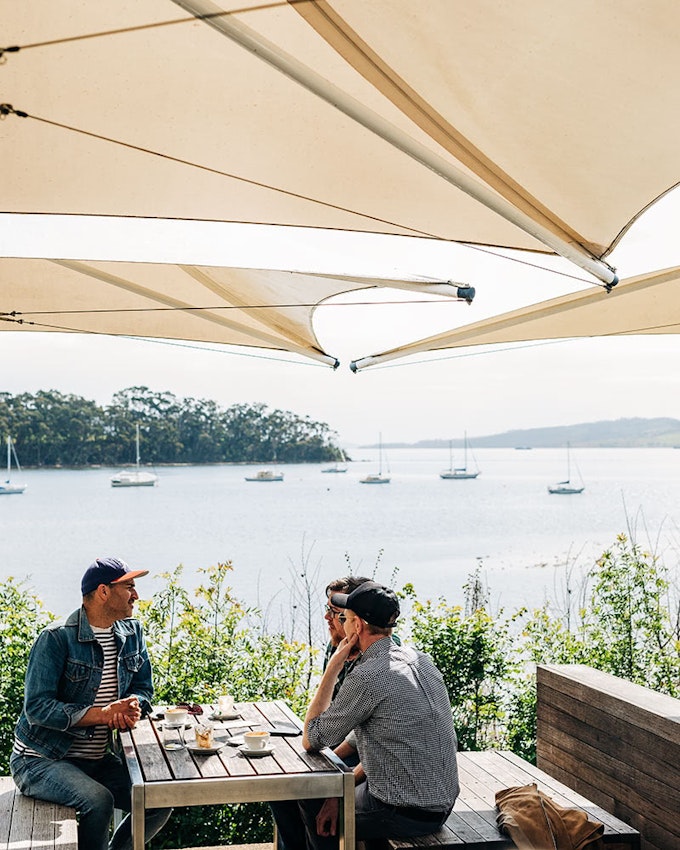 Diners at a waterfront restaurant.