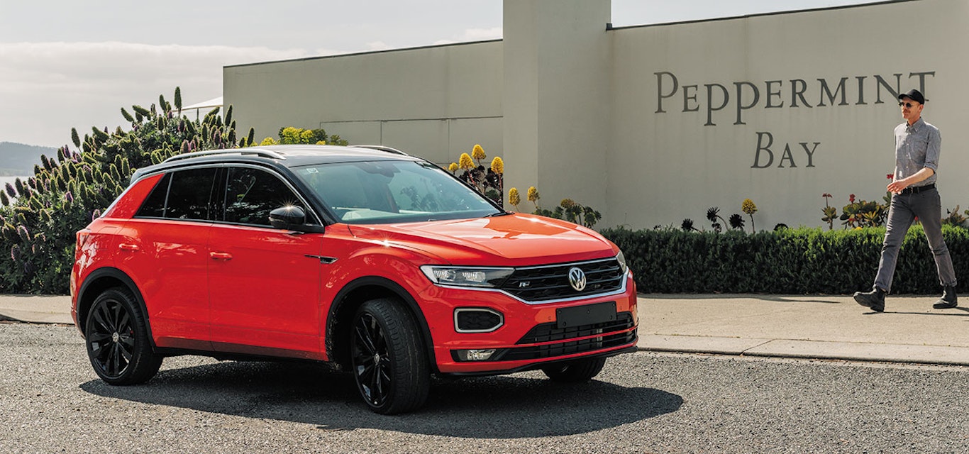 Car parked outside restaurant.