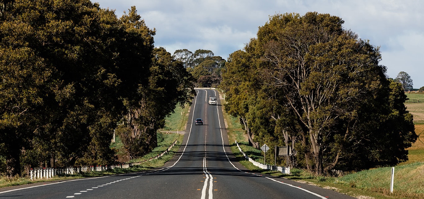 A truck coming down a rural highway