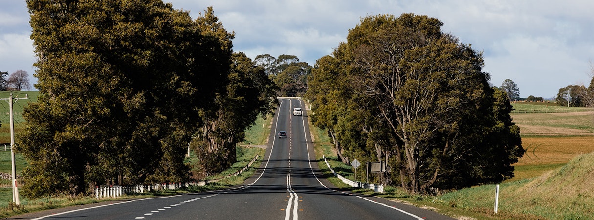 A truck coming down a rural highway