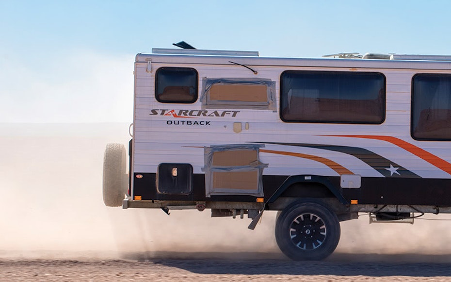Caravan driving in the dust