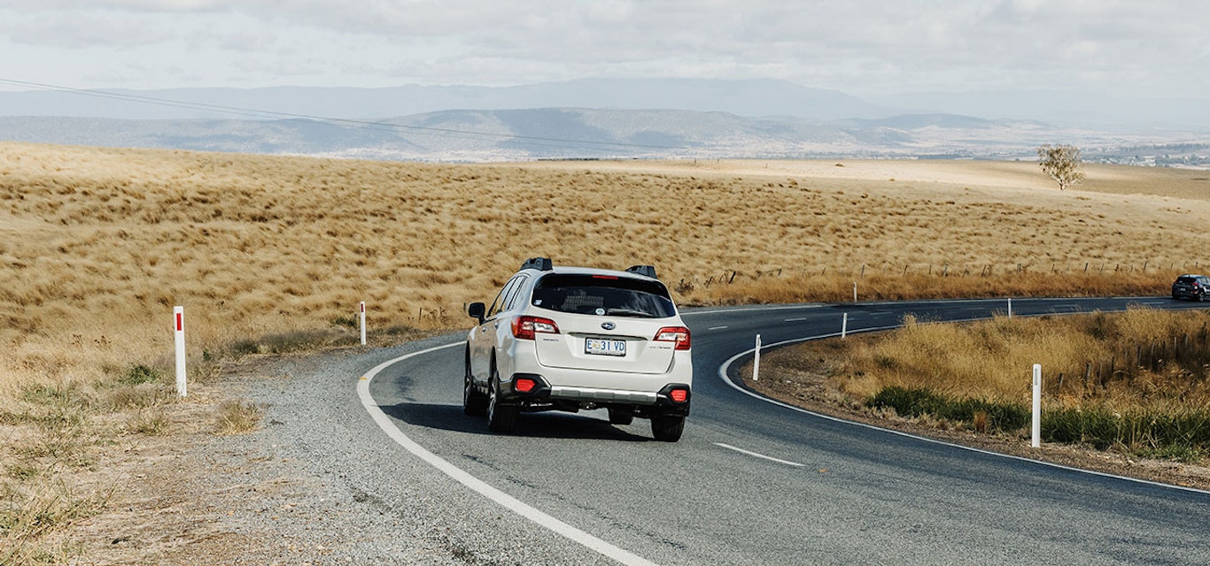 White car on rural road