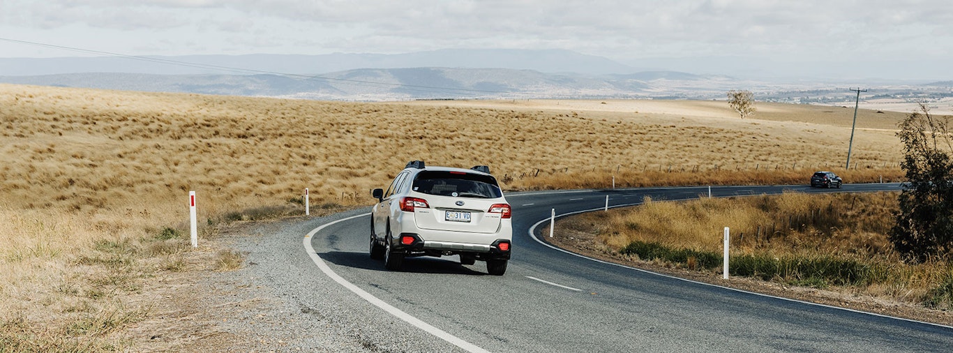 White car on rural road