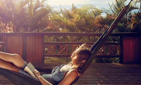 Person reading in a hammock.
