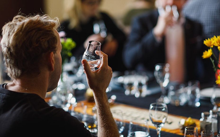 A man enjoying a glass of whisky