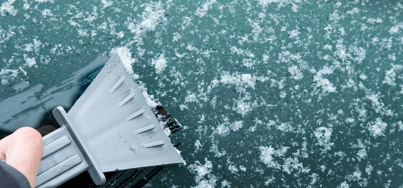 Ice scraper being used on a frosty windscreen