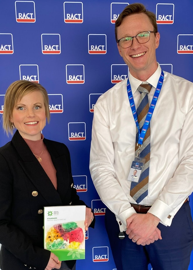 woman and man holding a certificate