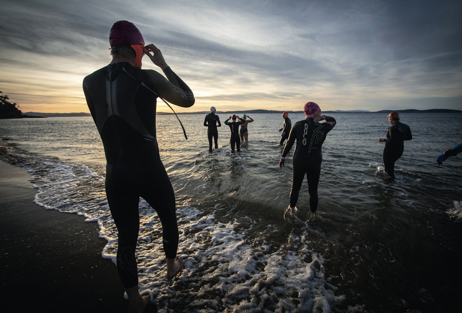 swimmers entering the ocean