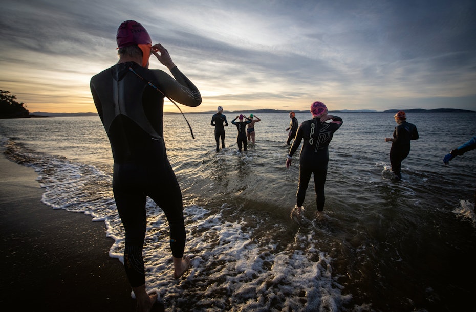 swimmers entering the ocean