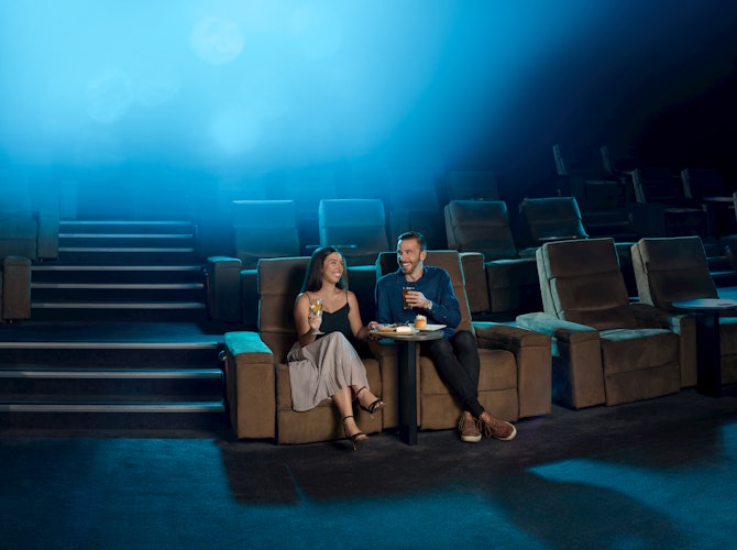 Couple sitting in gold class at Village cinemas.