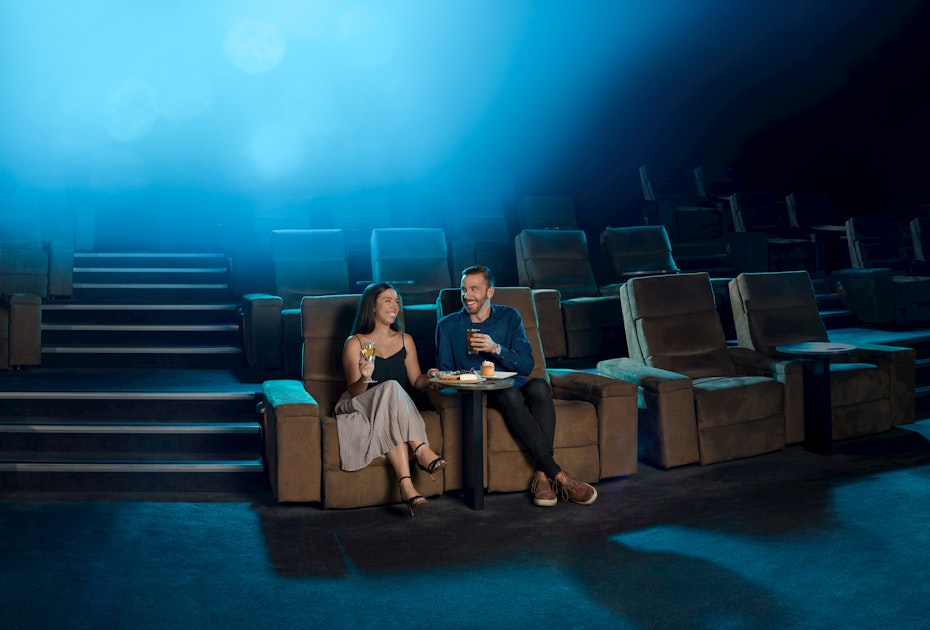 Couple sitting in gold class at Village cinemas.