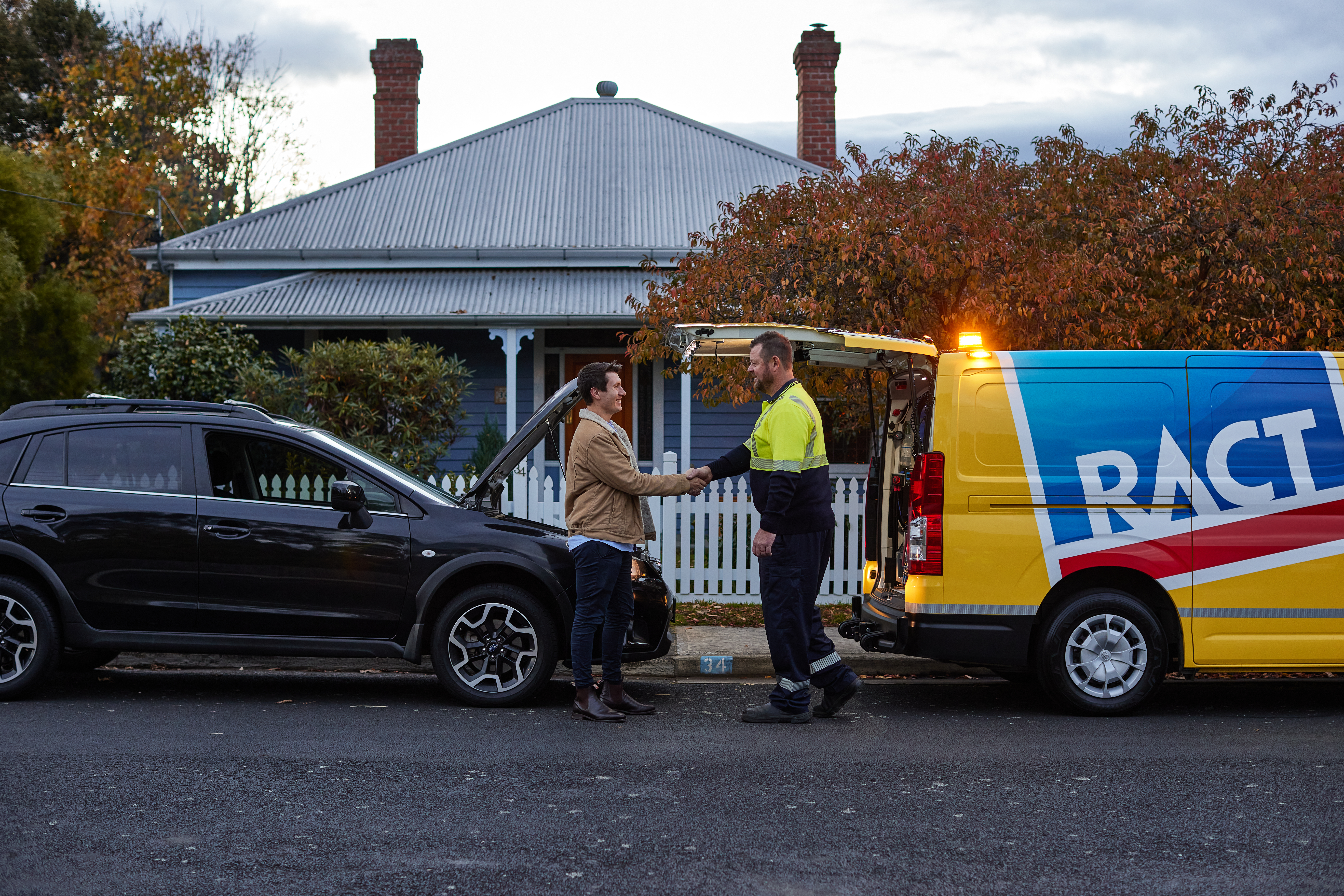 Member shaking the hand of roadside patrol.
