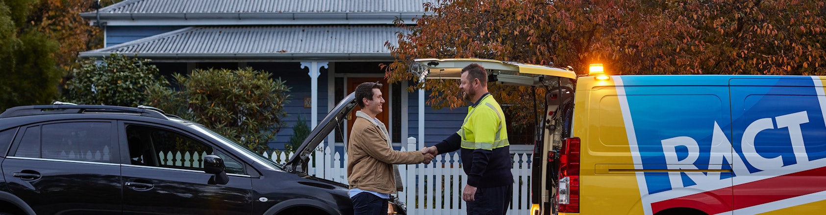 Member shaking the hand of roadside patrol.