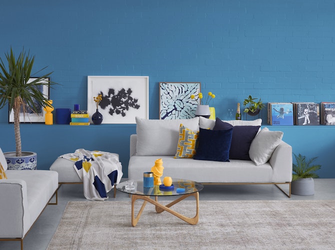 Painted vibrant blue decorated lounge room