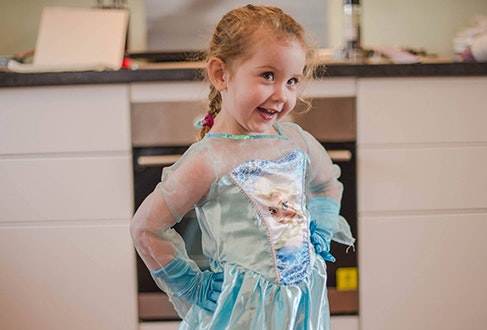 Young child dressed up as Elsa from Frozen.