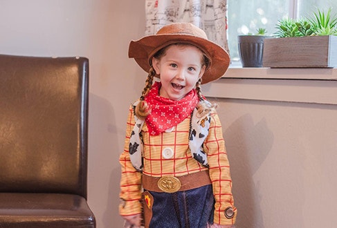 Child dressed up as Woody.