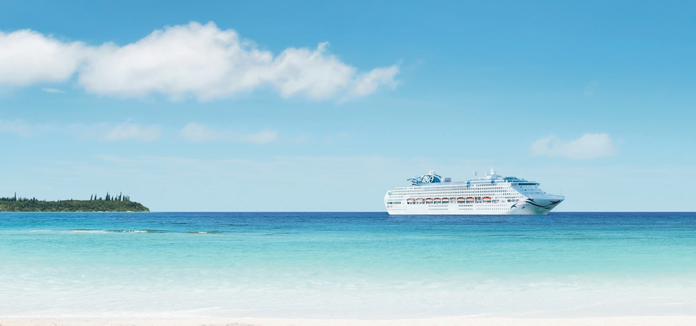 Cruise ship on the horizon of a tropical destination
