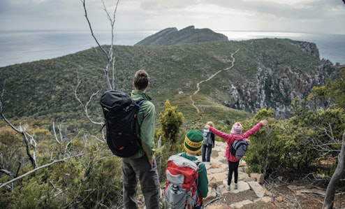 family walking on track