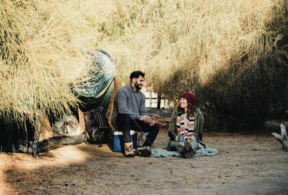 couple chatting whilst camping