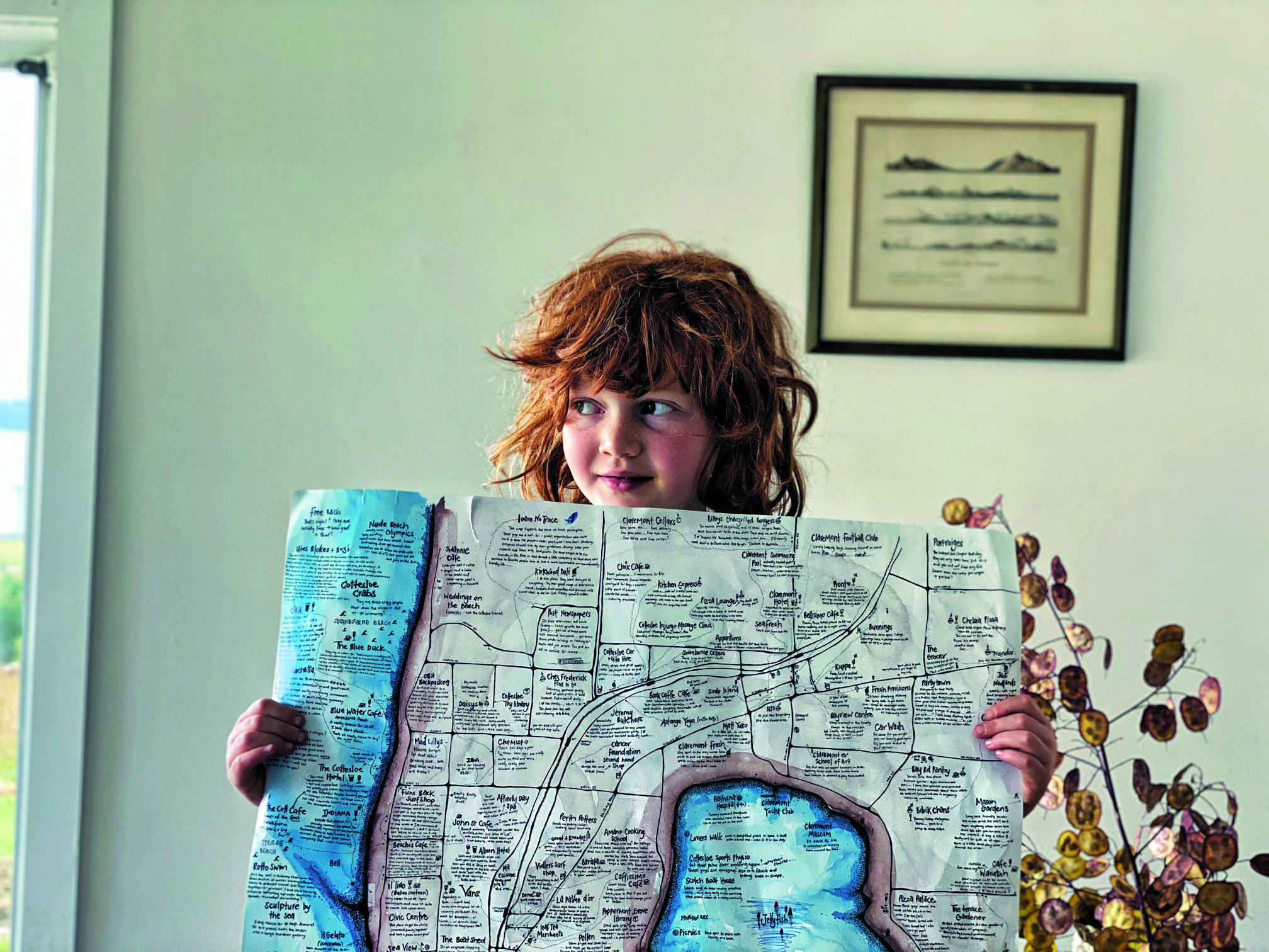 child holding hand drawn map