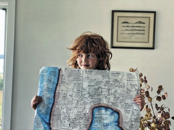 child holding hand drawn map