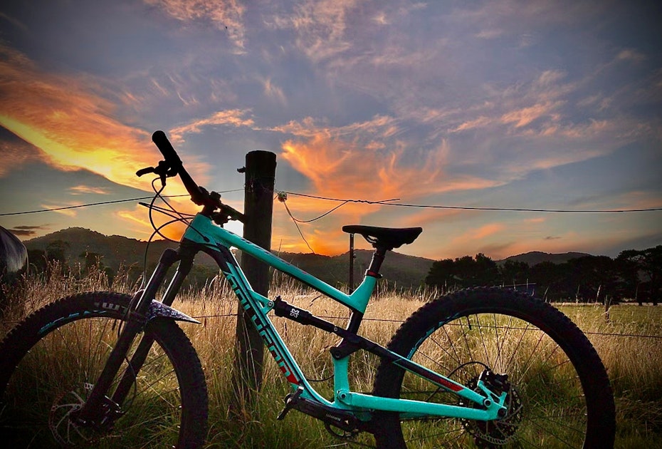 mountain bike in front of colourful sky